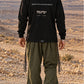 Divine Order (long sleeve) של 613, חולצת ציצית שחורה עם שרוול ארוך, צילום חוץ בנוף מדברי
