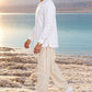 Divine Order (long sleeve) של 613, חולצת ציצית לבנה עם שרוול ארוך, צילום חוץ מול נוף פתוח