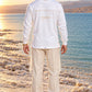 Divine Order (long sleeve) של 613, חולצת ציצית לבנה עם שרוול ארוך, צילום חוץ מול נוף פתוח